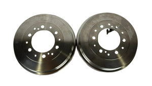 Two metallic brake rotors on a white background