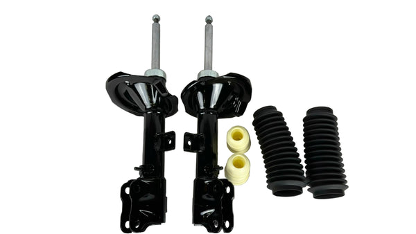 Set of car shock absorbers and springs on a white background