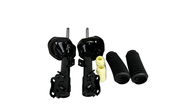 Automotive suspension components including shock absorbers, springs, and bushings on a white background