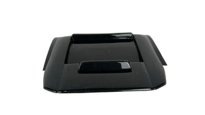 Black car hood on a white textured surface